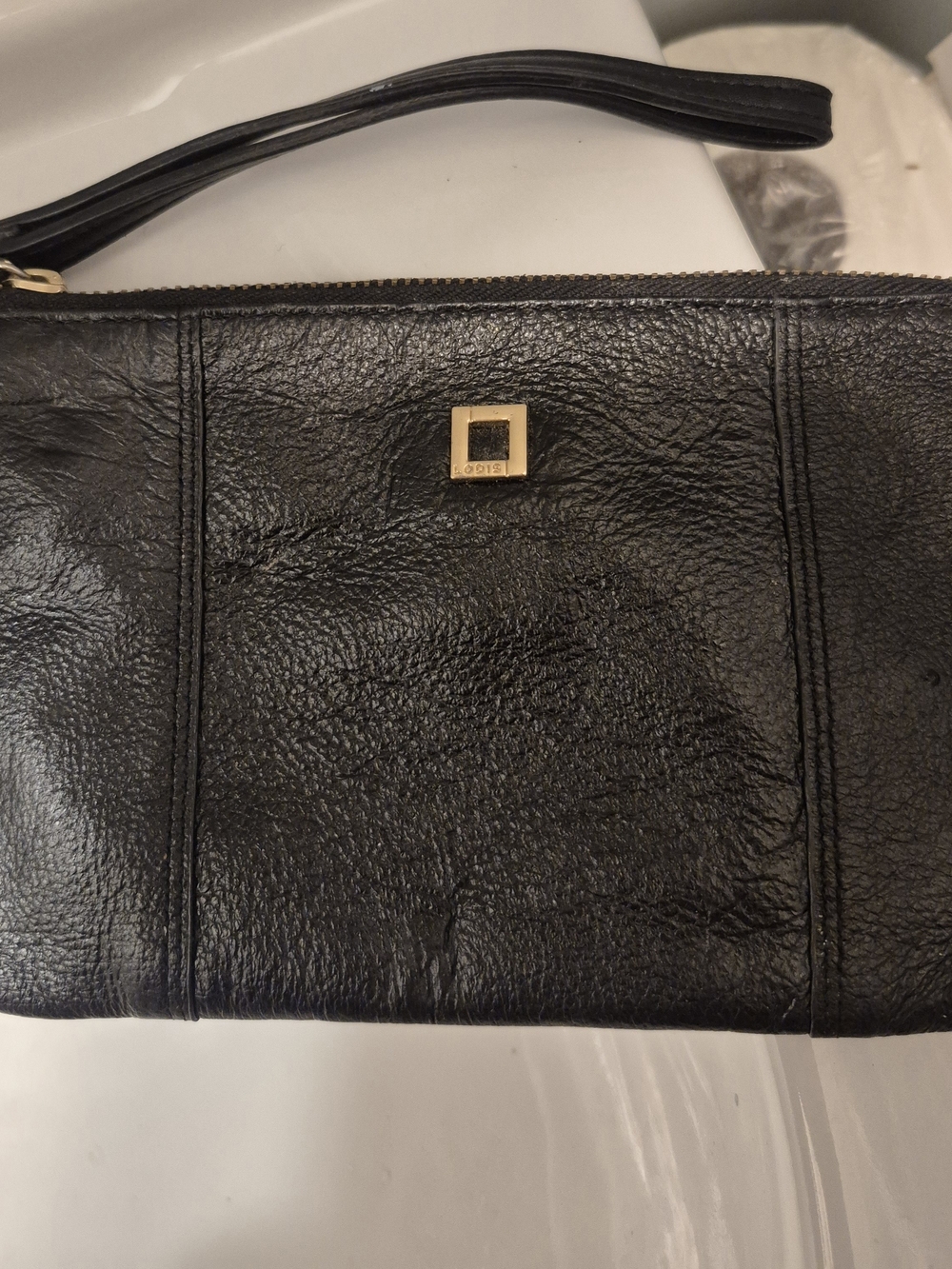 Lodis Black Leather Wristlet with Gold Square Logo Accent